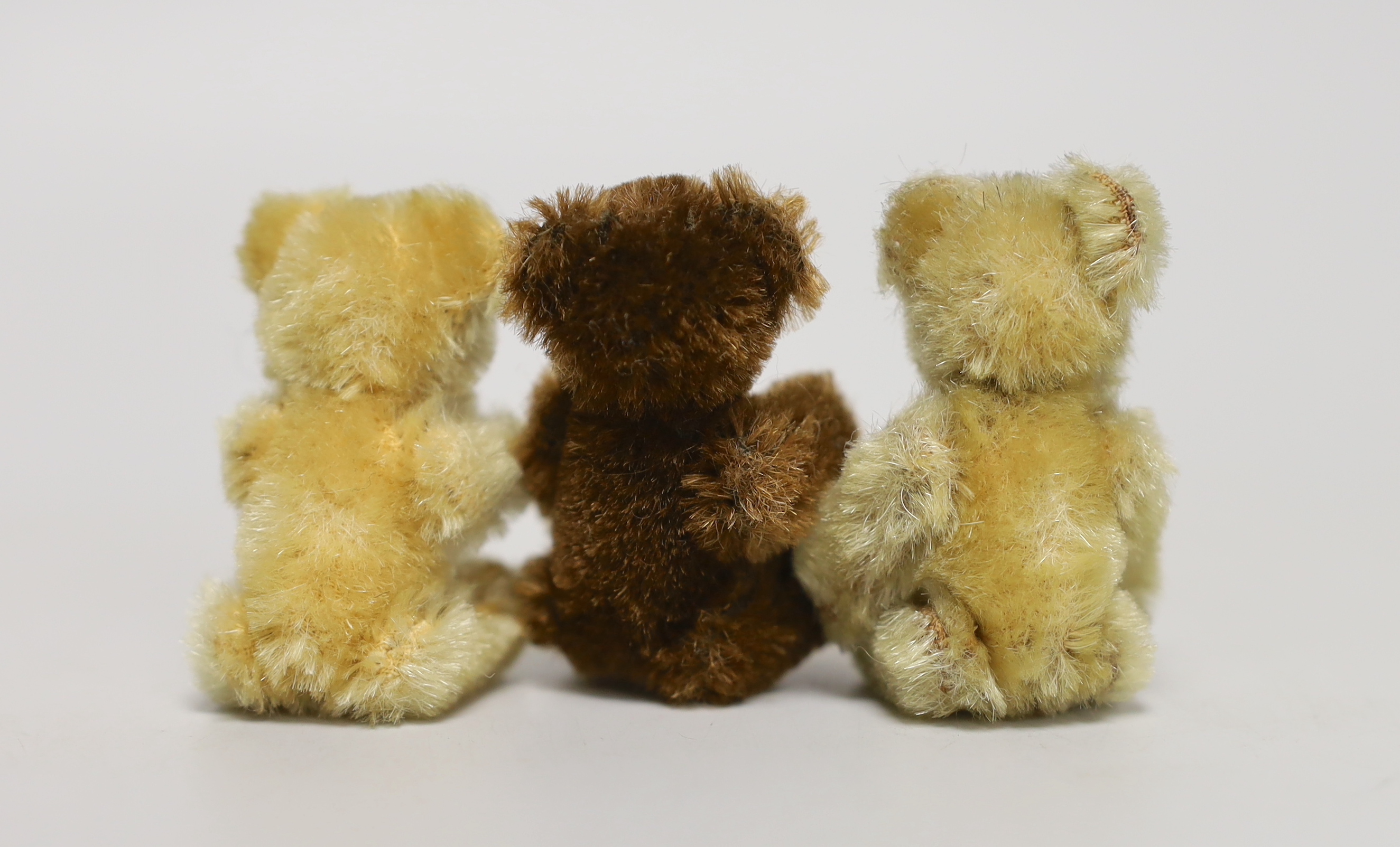 Three Schuco 1950's bears: two blonde, one brown, 3in.